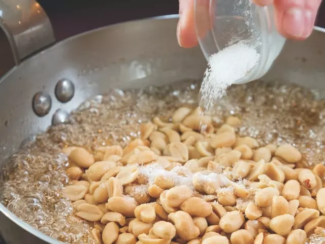 stirring peanuts with sugar